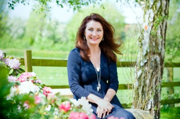 Adrienne in garden. (landscape)